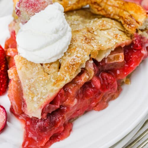 Strawberry Rhubarb Pie with whipped cream