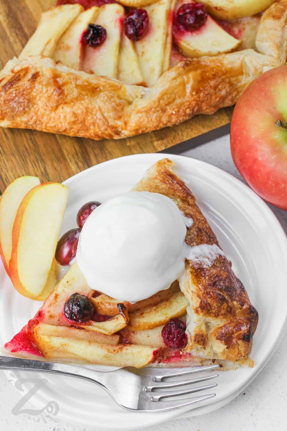 plated slice of Apple Galette with ice cream on top