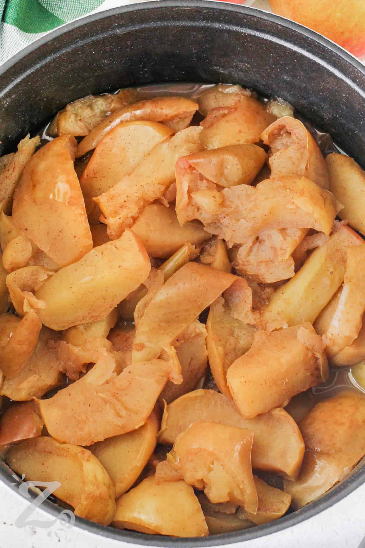 apples simmered in a pot to make homemade apple sauce