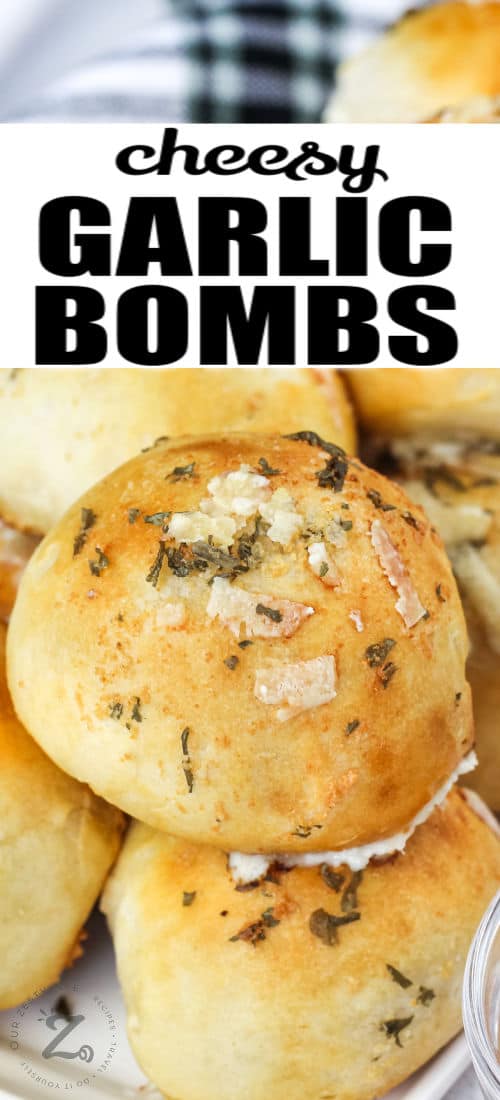 Garlic cheese bombs stacked on a serving plate with text