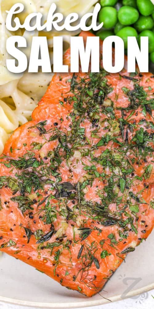 a baked salmon fillet being served on a plate with text