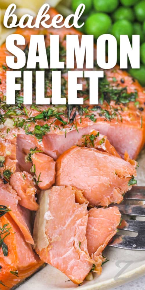 A salmon fillet being broken apart by a fork with text