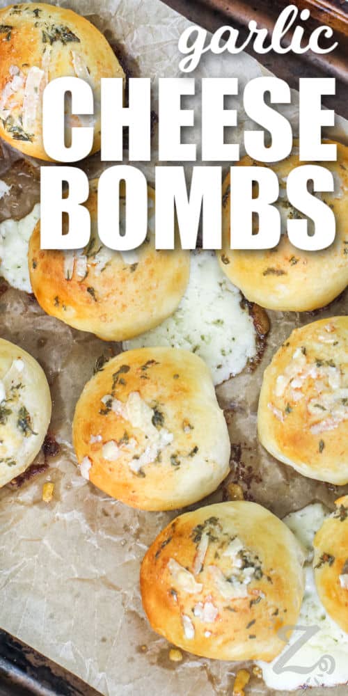 baked garlic cheese bombs on a baking pan with text