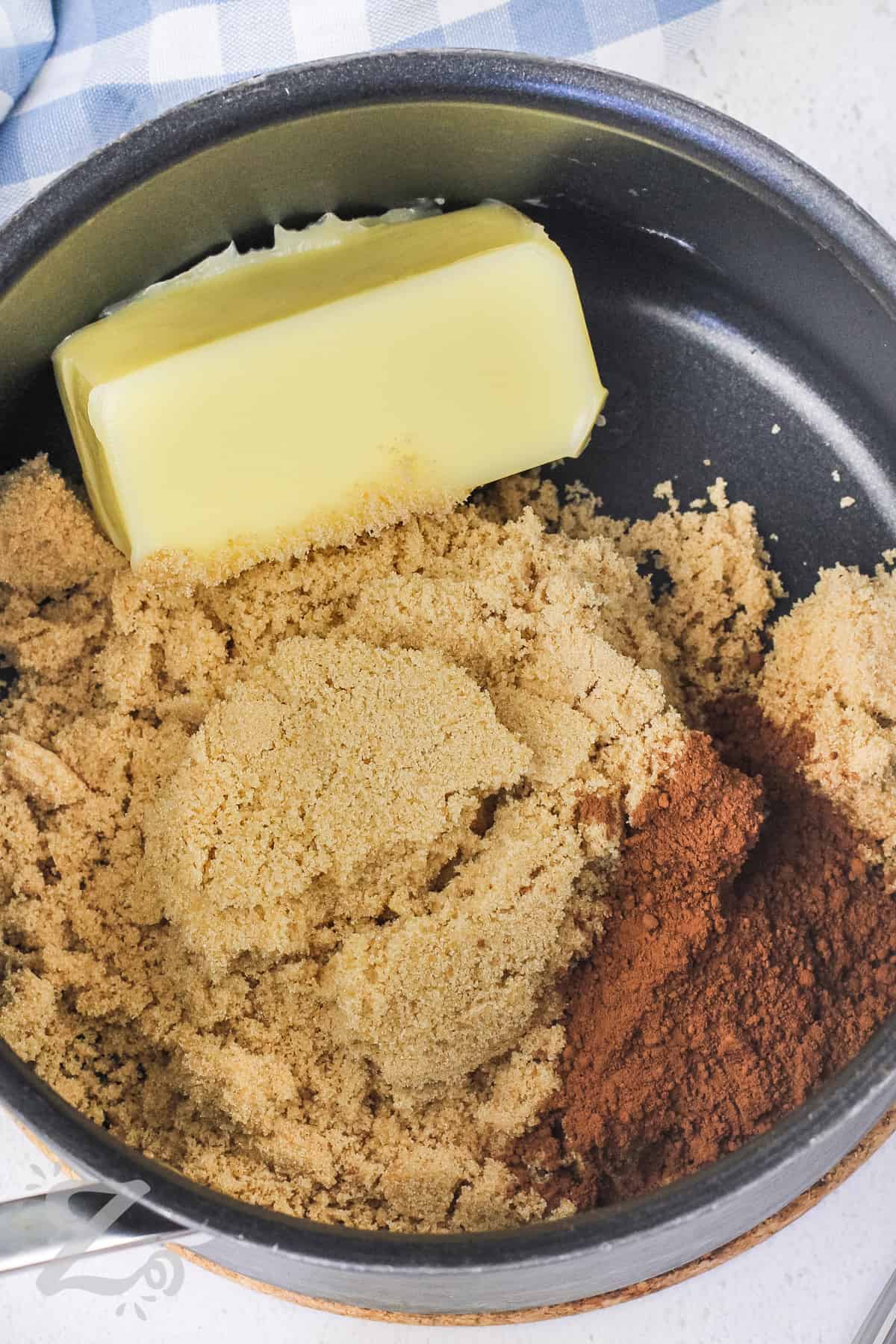 Butter and sugar being combined in a sauce pan