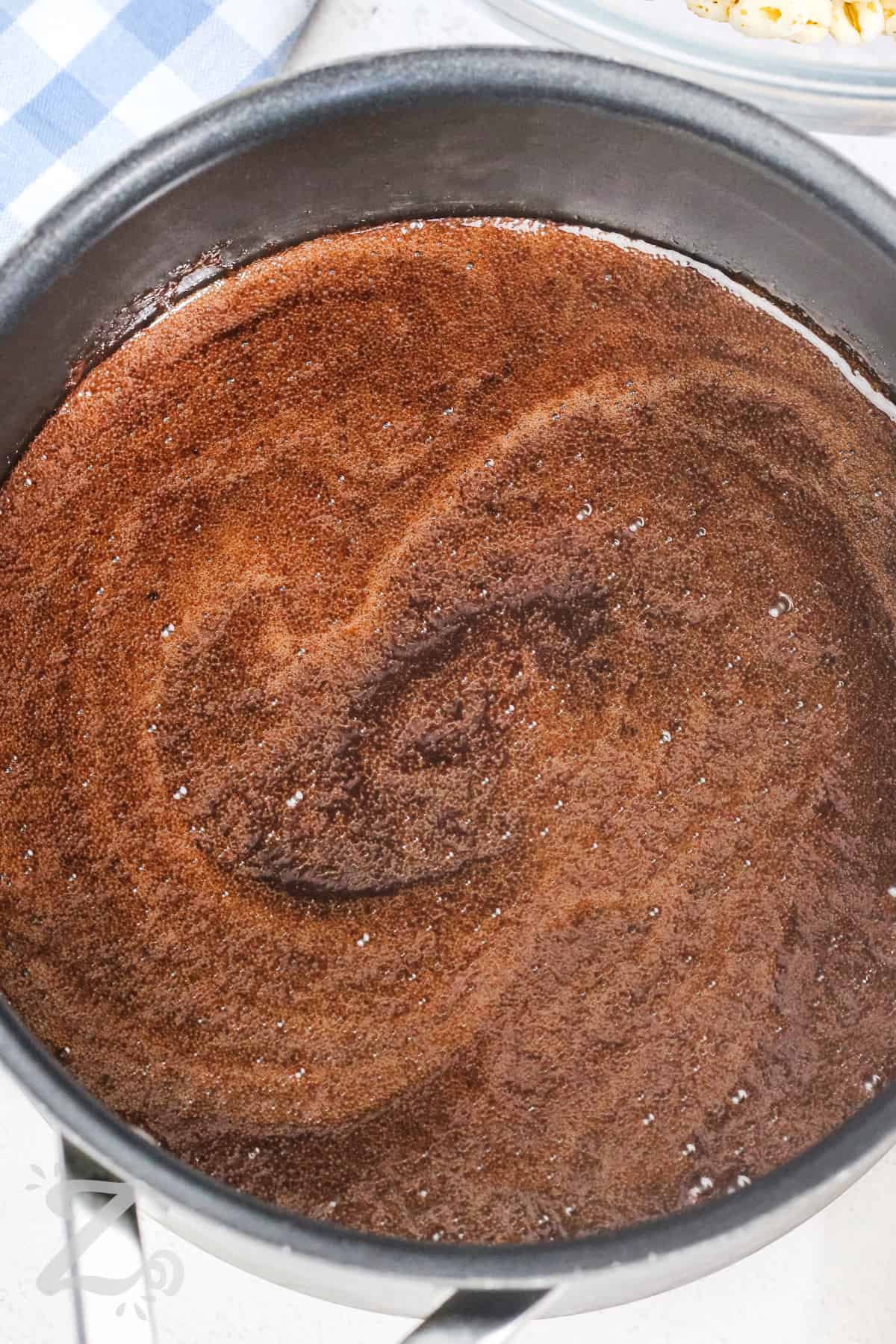 Puffed wheat sauce mixture prepared in a sauce pan