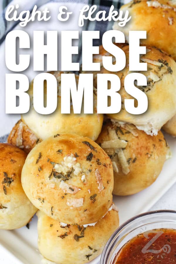 Garlic cheese bombs on a serving tray with marinara sauce with text