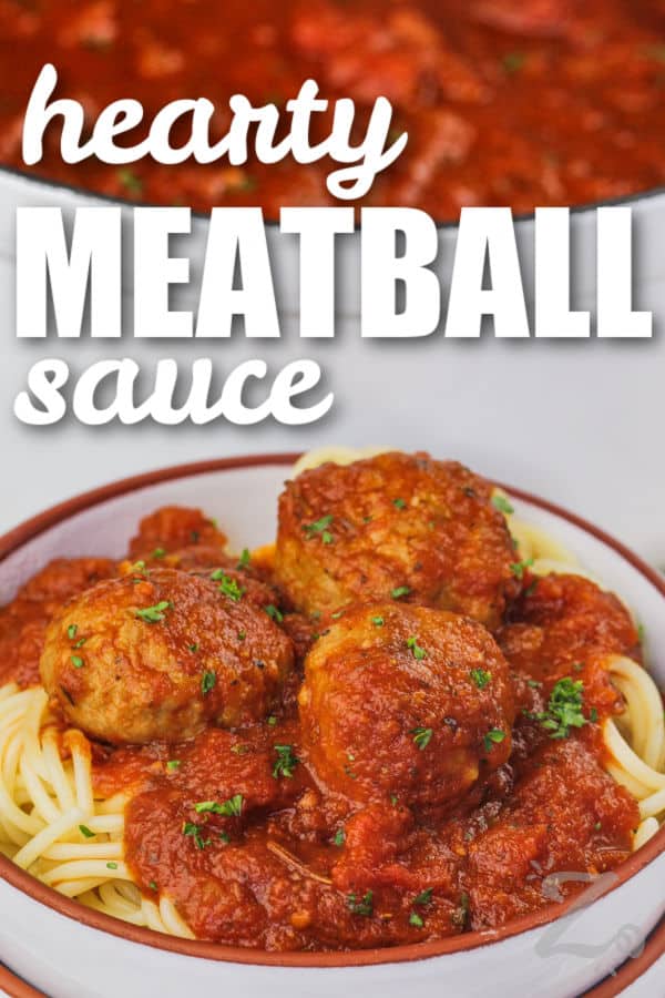 hearty meatballs with sauce over spaghetti with text