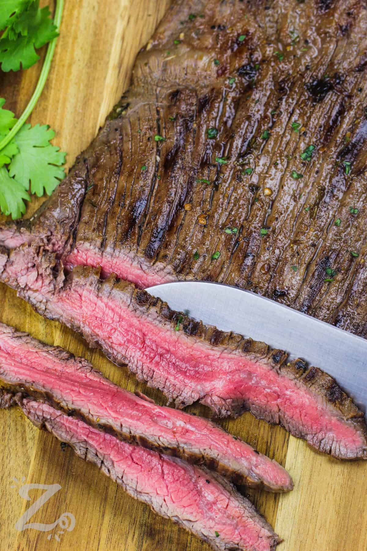 slicing steak to make Steak Fajitas