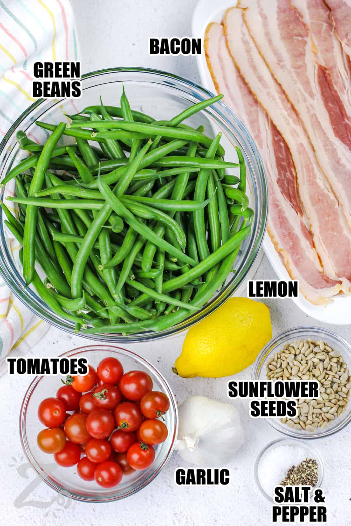 green beans , bacon , lemon , sunflower seeds , garlic , tomatoes , salt and pepper with labels to make Green Beans with Bacon