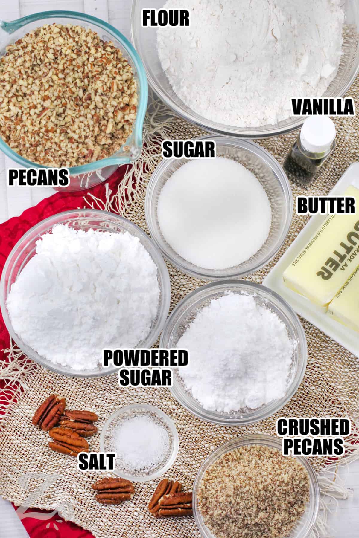 flour , vanilla , sugar , pecans , powdered sugar , crushed pecans , salt with labels to make Pecan Snowball Cookies