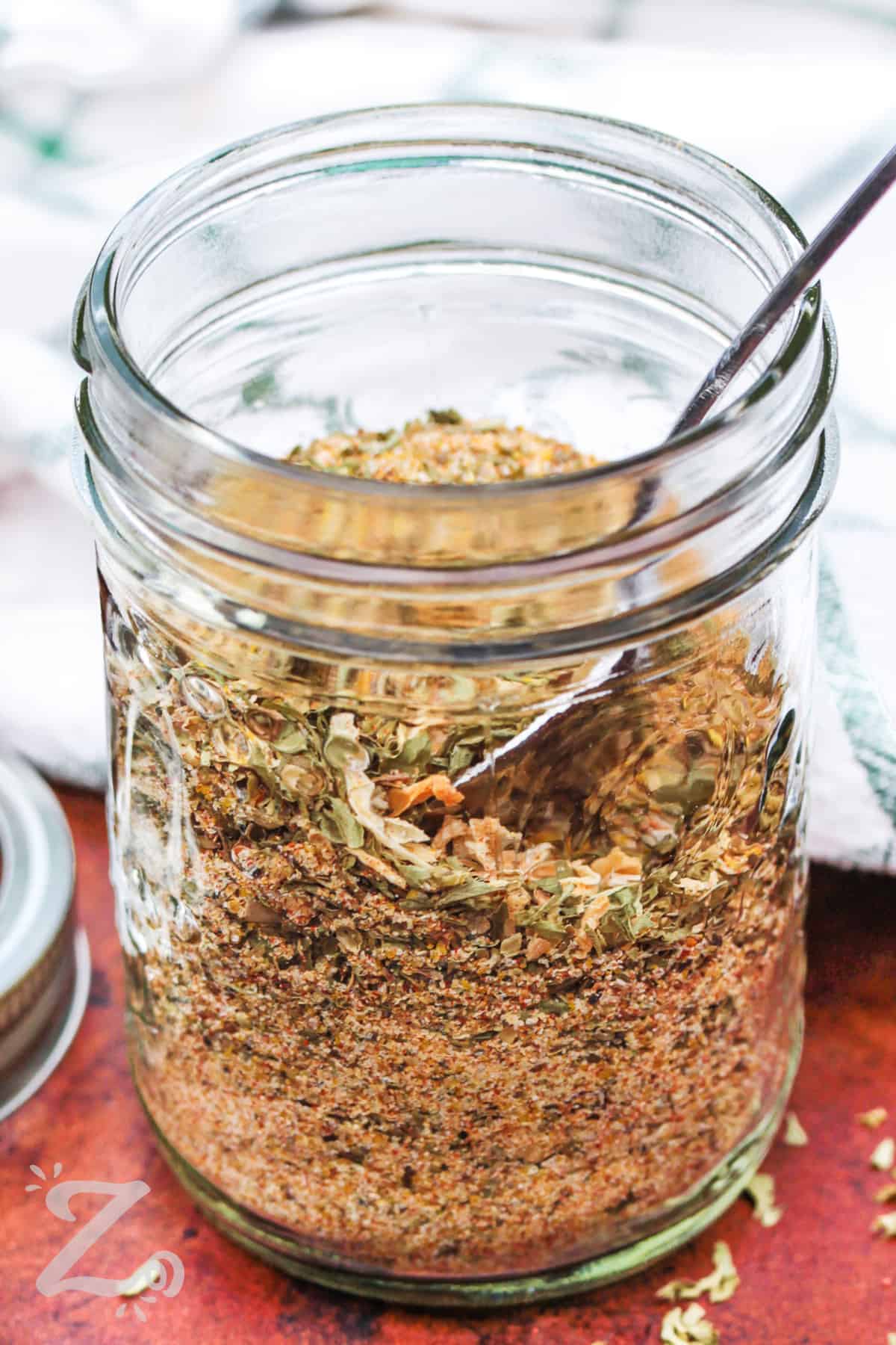 jar of Italian Dressing Mix with a spoon