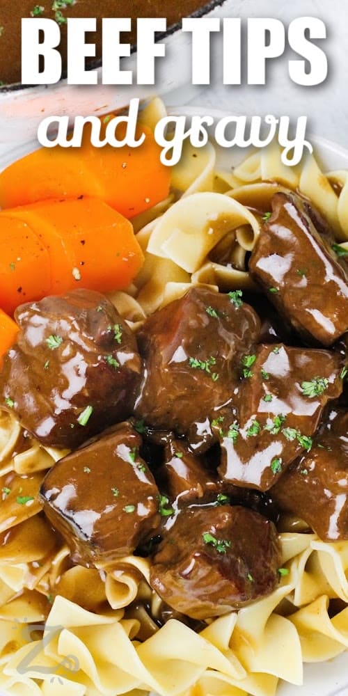 beef tips in gravy served over noodles with text