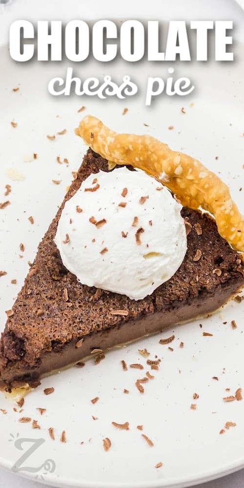 a slice of chocolate chess pie topped with whipped cream and chocolate shavings with text