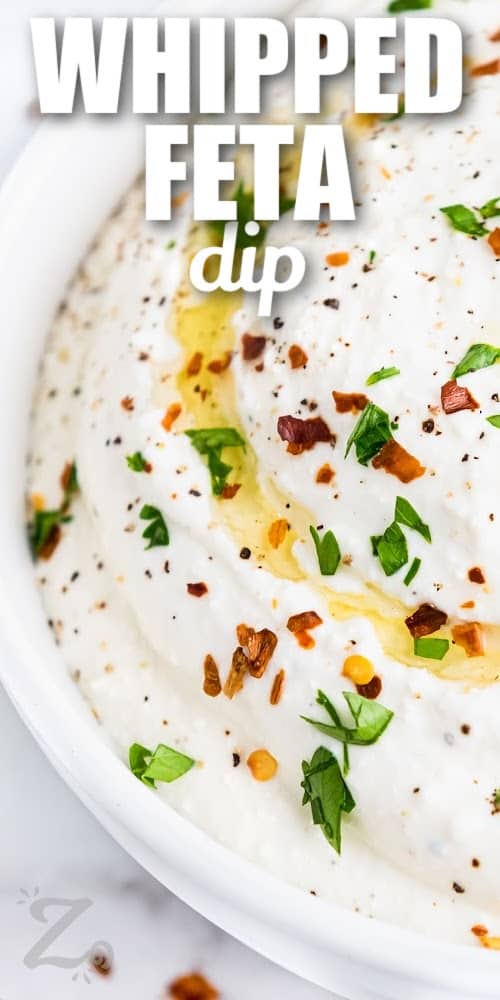 Whipped feta dip with an olive oil drizzle with text
