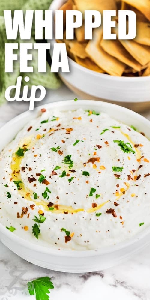 A bowl of whipped feta dip with text