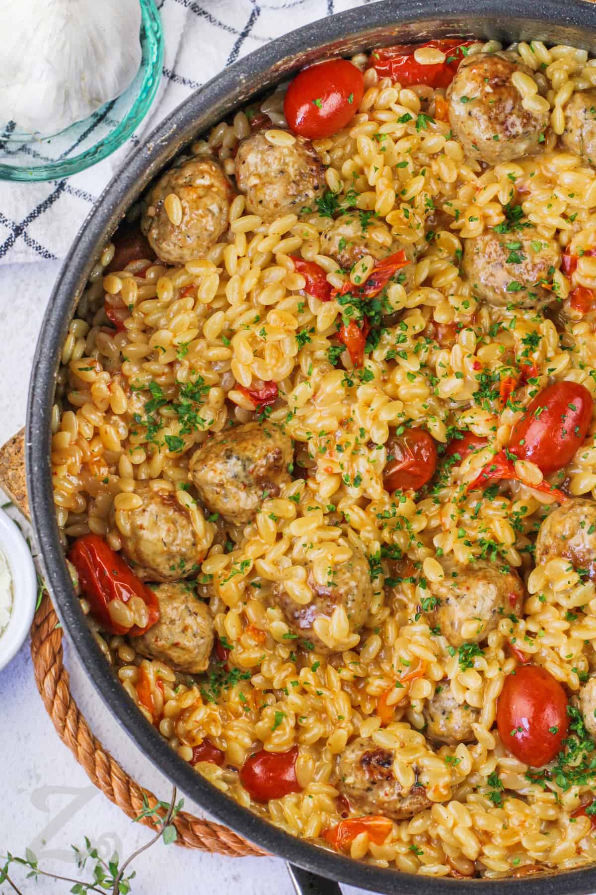pot full of One Pot Tomato Orzo With Meatballs