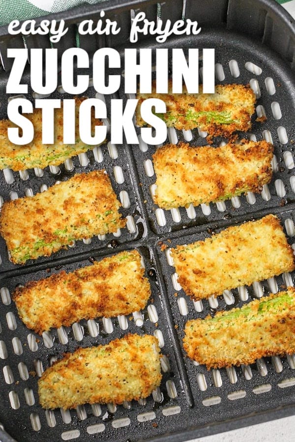 zucchini sticks in an air fryer basket with a title