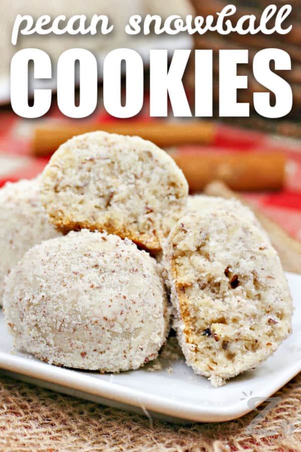 Pecan Snowball Cookies on a plate with a title