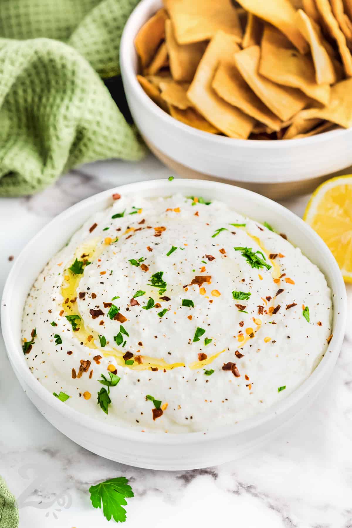 crackers in a bowl along with whipped feta dip