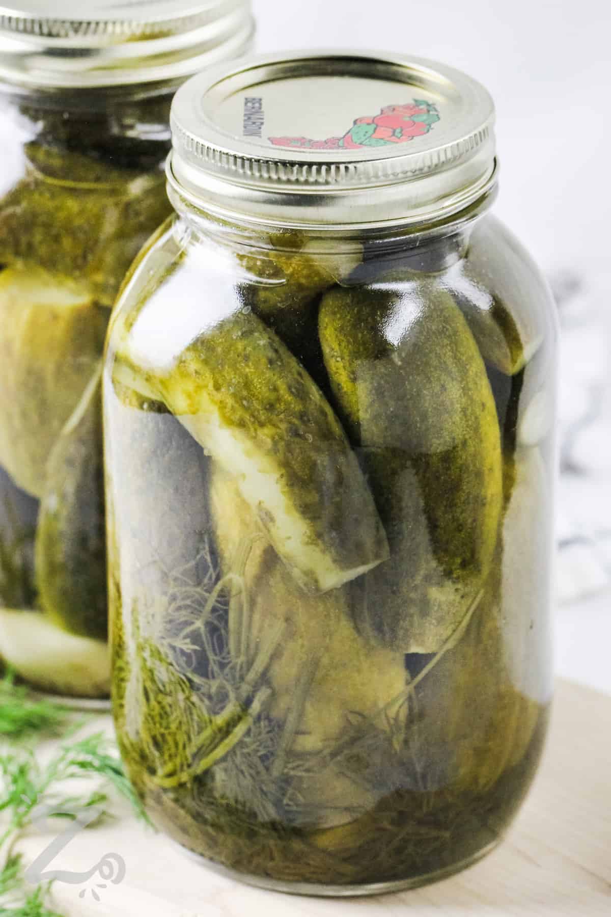 Two jars of prepared dill pickles