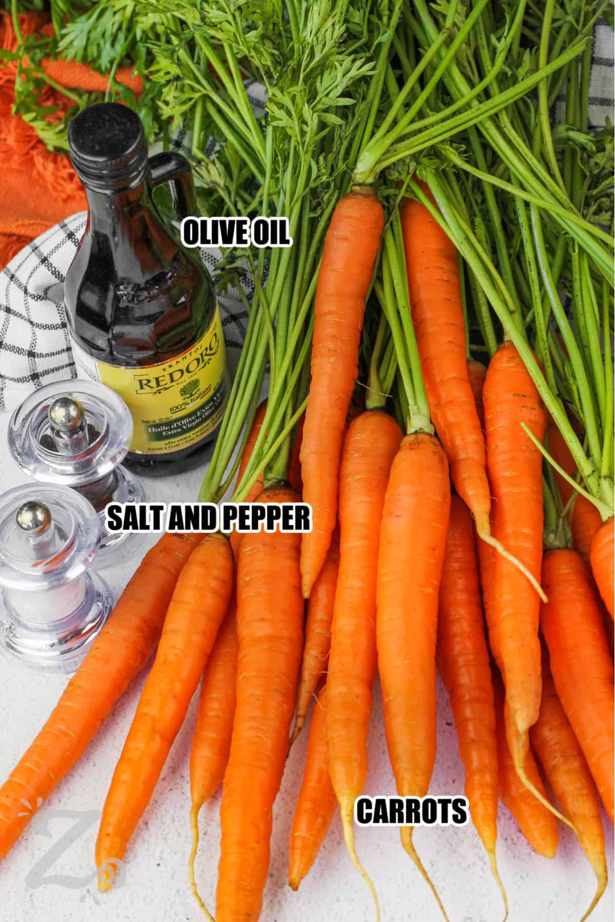 ingredients for Oven Roasted Carrots including carrots, olive oil, salt, and pepper