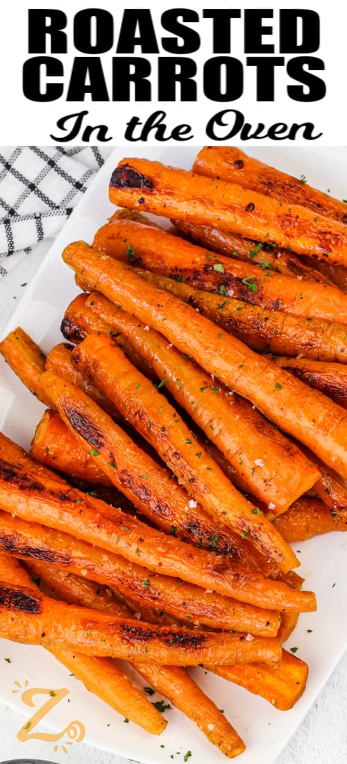 Oven Roasted Carrots on a white plate with writing
