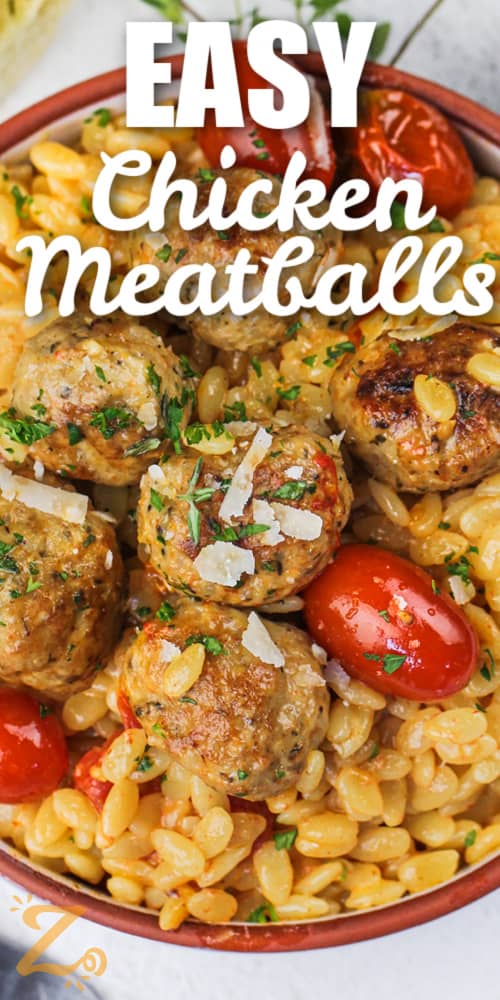 Chicken meatballs in a bowl with pasta and tomatoes with a title