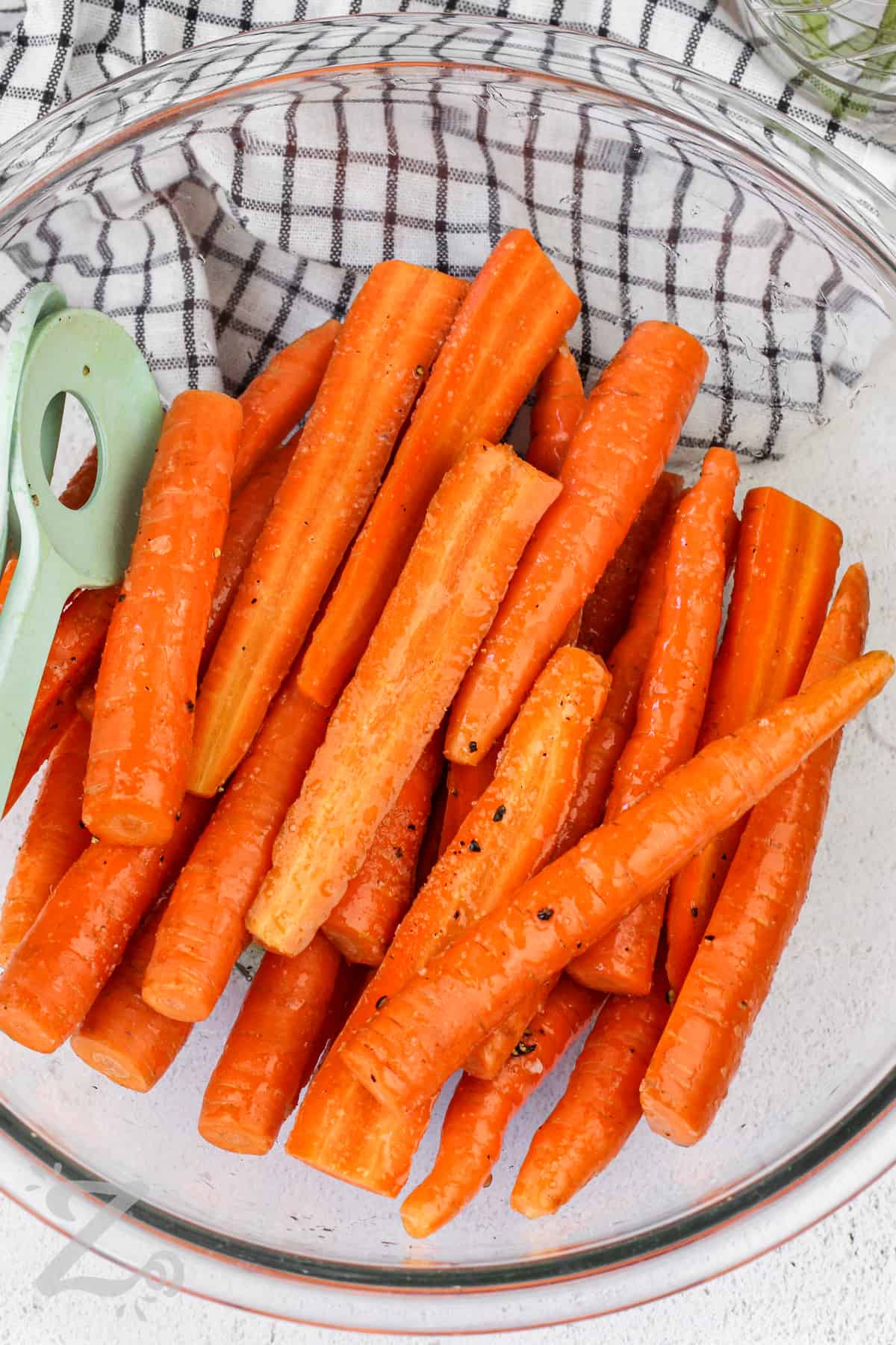 raw carrots in a bowl for Oven Roasted Carrots