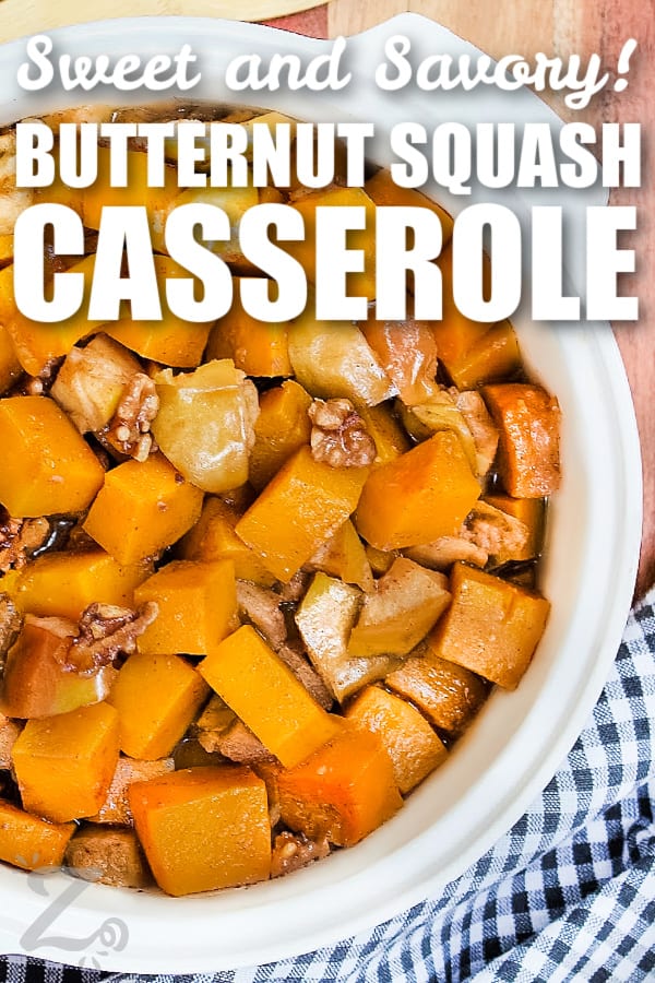 butternut squash casserole in a white casserole dish with writing