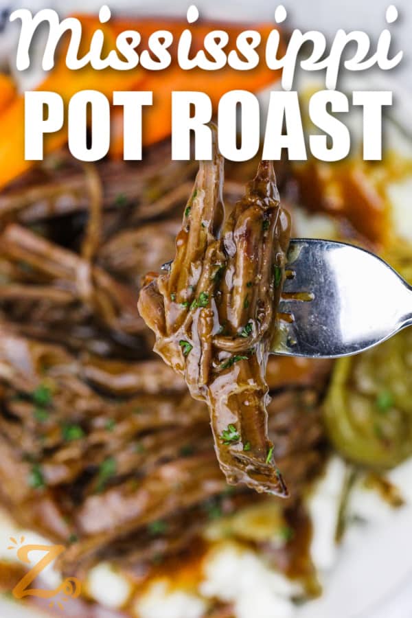 slow cooker Mississippi pot roast on a fork with writing