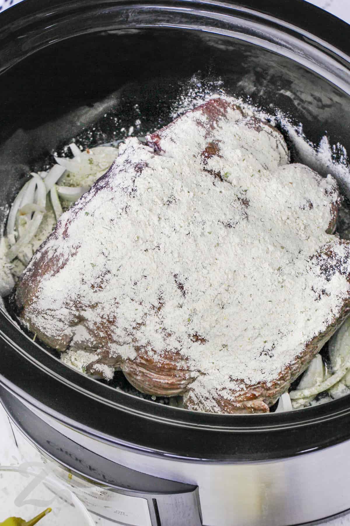 pot roast in a slow cooker covered in cornstarch for slow cooker Mississippi pot roast