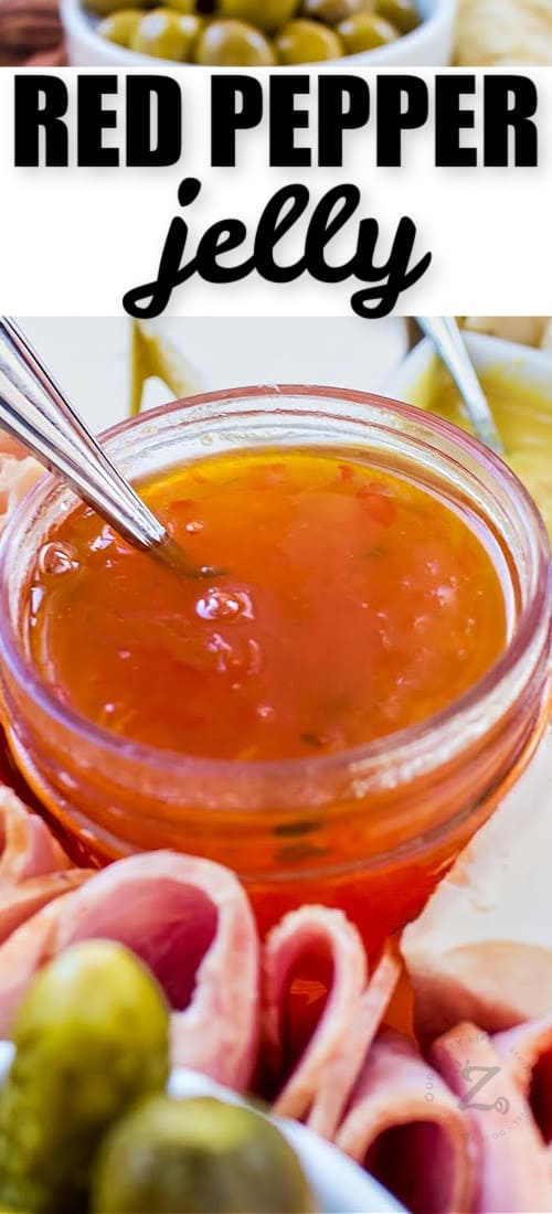 red pepper jelly in a clear jar with writing