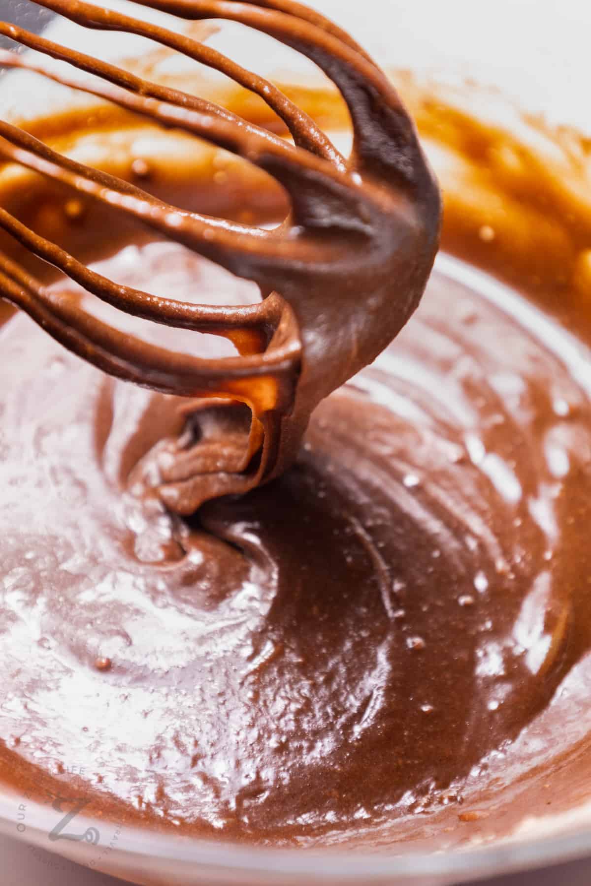 batter for Peanut Butter Brownies with a whisk