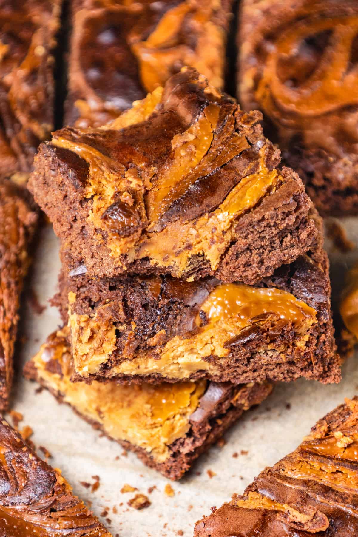 stack of three Peanut Butter Brownies with a bite taken out of one