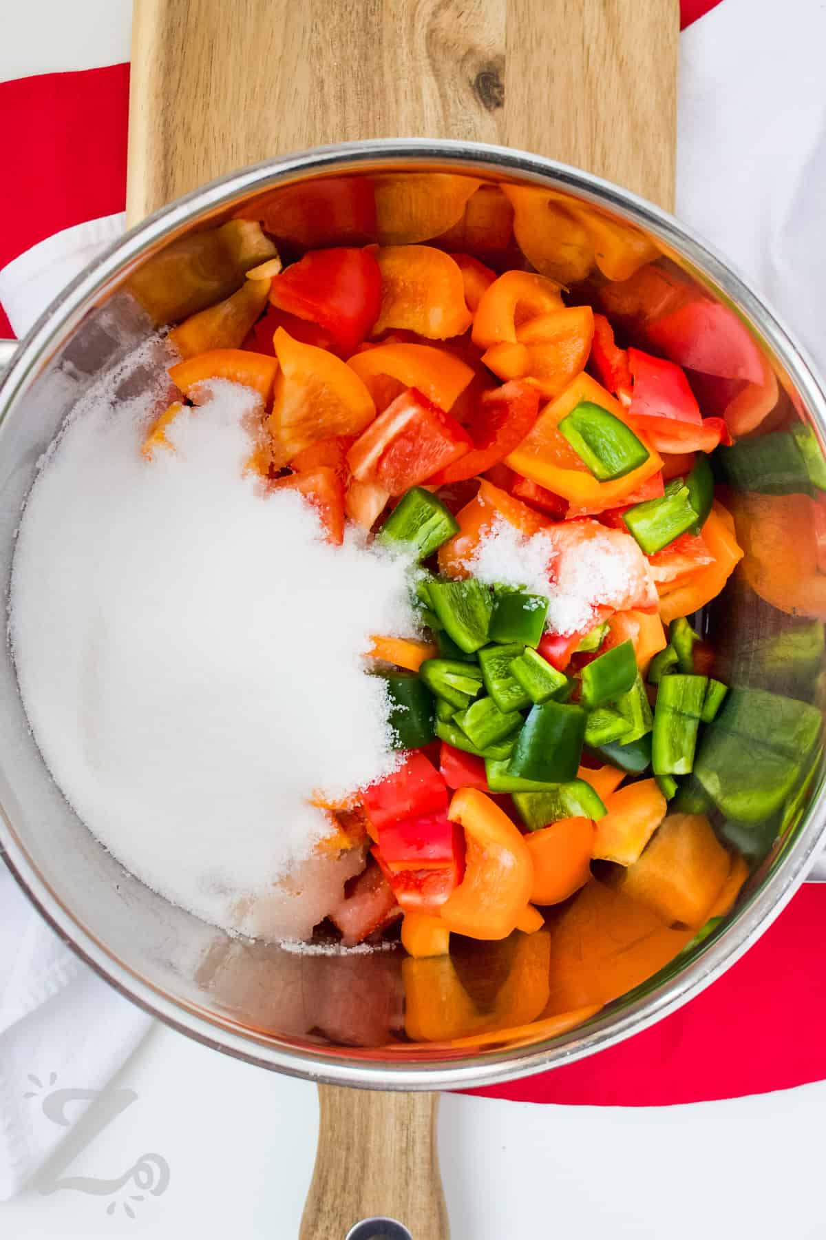 ingredients to make red pepper jelly in a pot