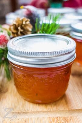 red pepper jelly in a jar with a lid