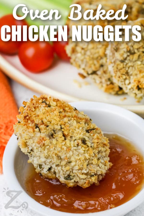 Chicken Nugget being dipped into sauce with a title
