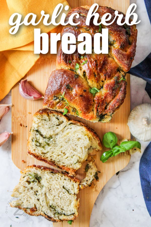 garlic herb bread cut into slices with writing
