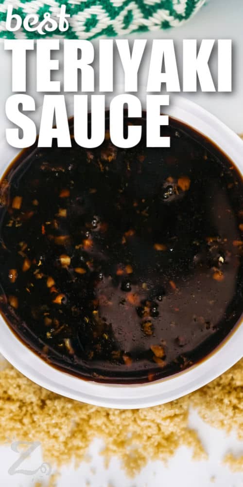 bowl of Best Teriyaki Sauce with brown sugar around it and a title