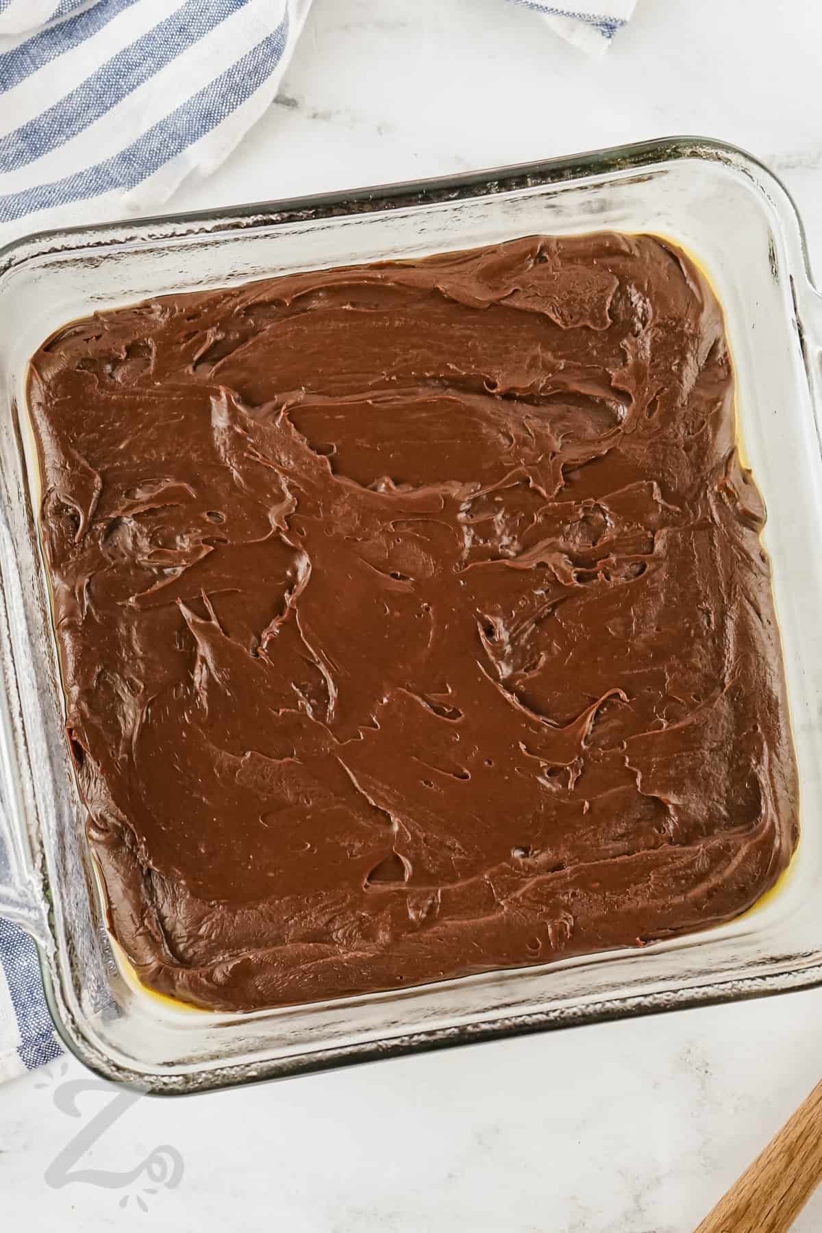adding 2 Ingredient Chocolate Fudge ingredients to dish