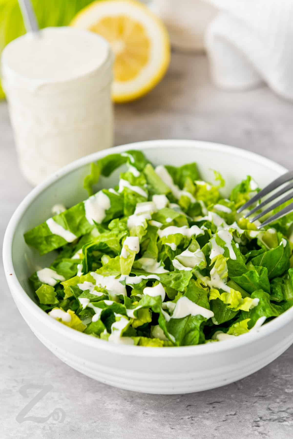 Caesar Salad Dressing on lettuce