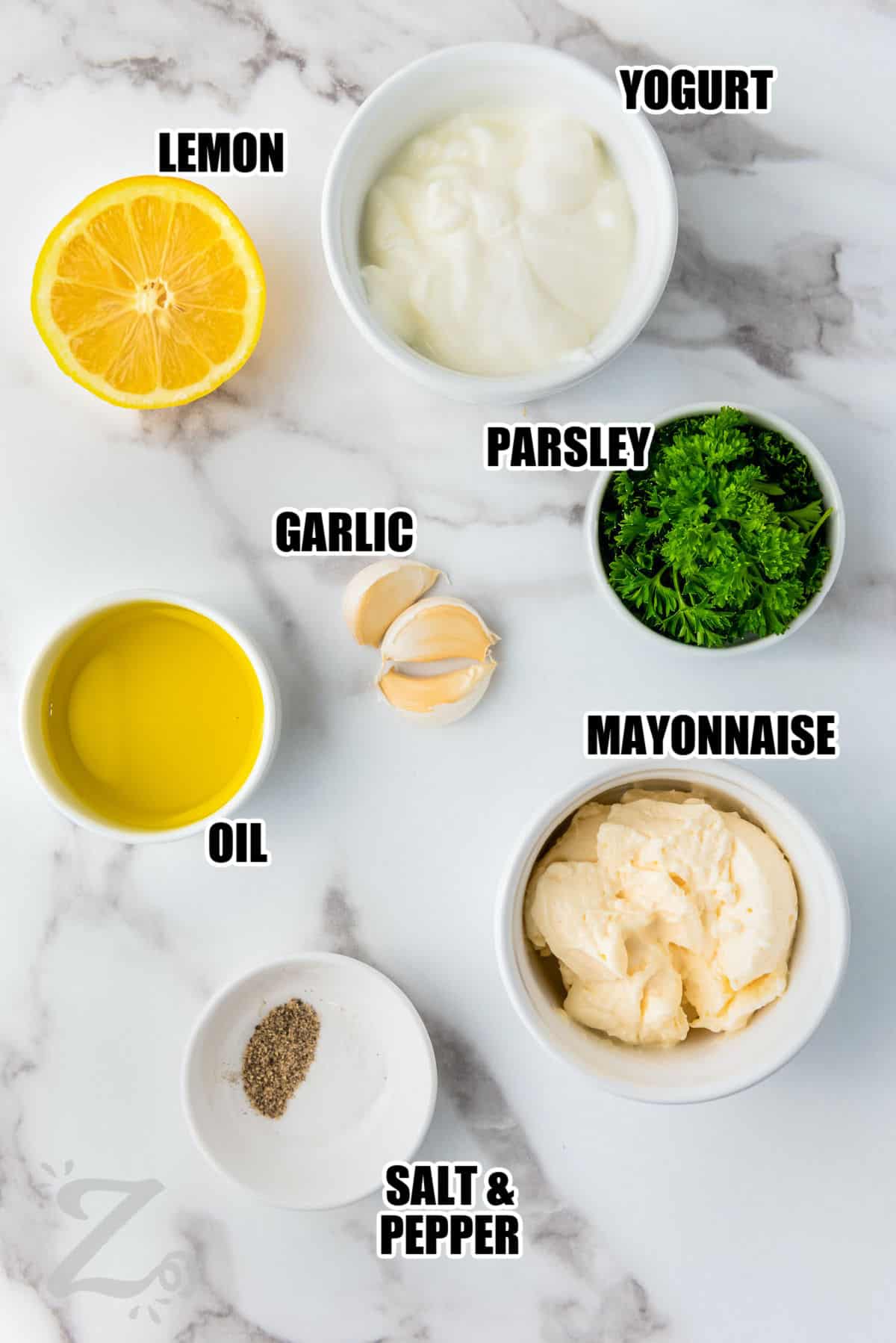 yogurt , lemon , garlic , parsley , oil , mayonnaise , salt and pepper with labels to make Homemade Garlic Sauce