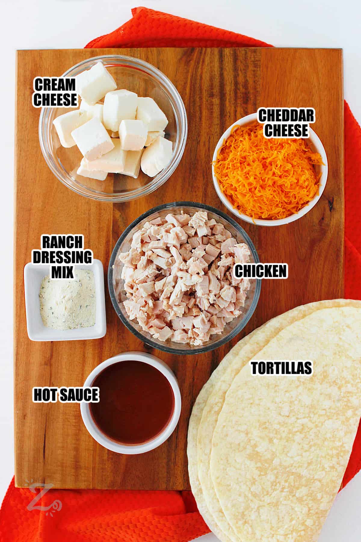 cream cheese , ranch dressing mix , hot sauce , tortillas , chicken and cheese with labels to make Buffalo Chicken Pinwheels