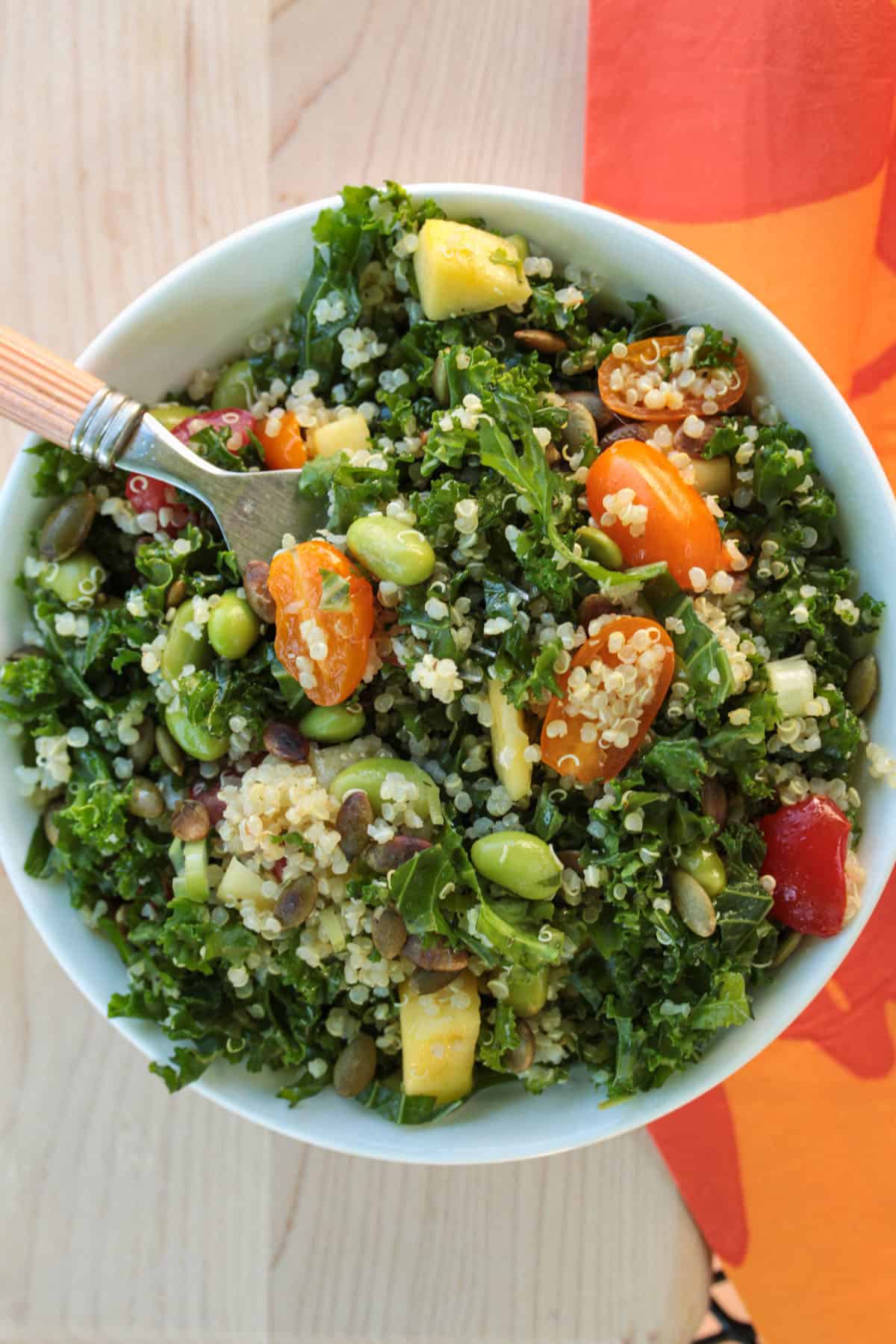 plated Kale Quinoa Salad with a fork