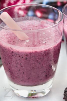 Mixed Berry Smoothie with a straw
