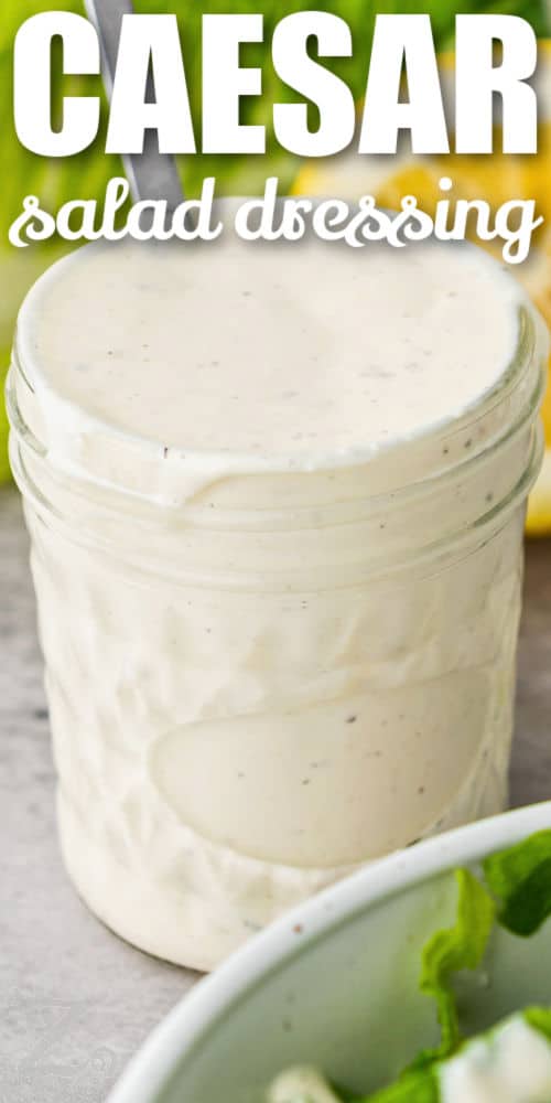 close up of Caesar Salad Dressing in a jar with writing