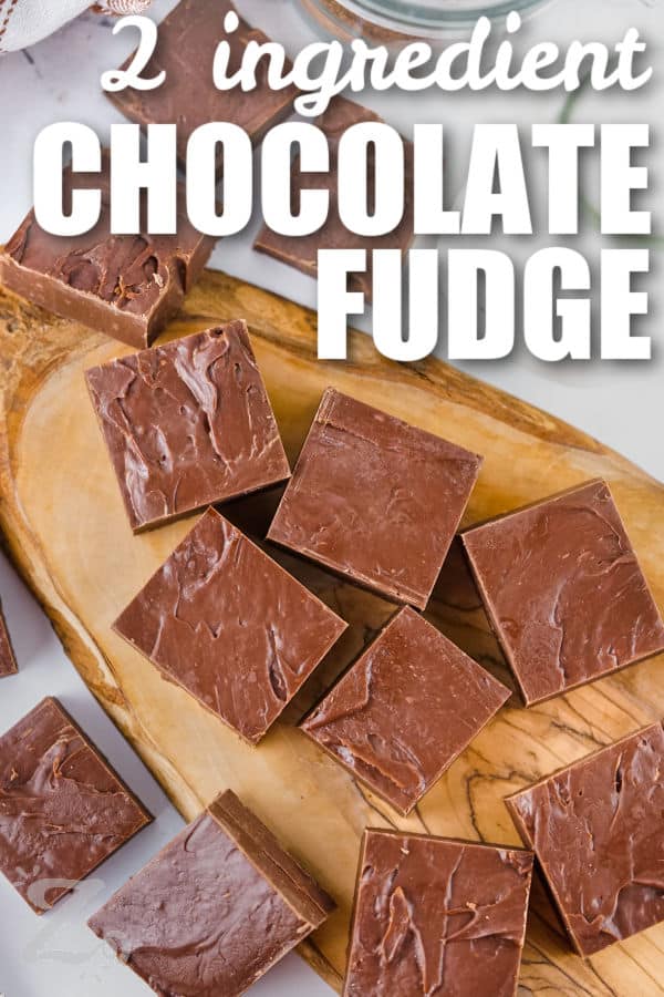 wooden board with 2 Ingredient Chocolate Fudge pieces and a title