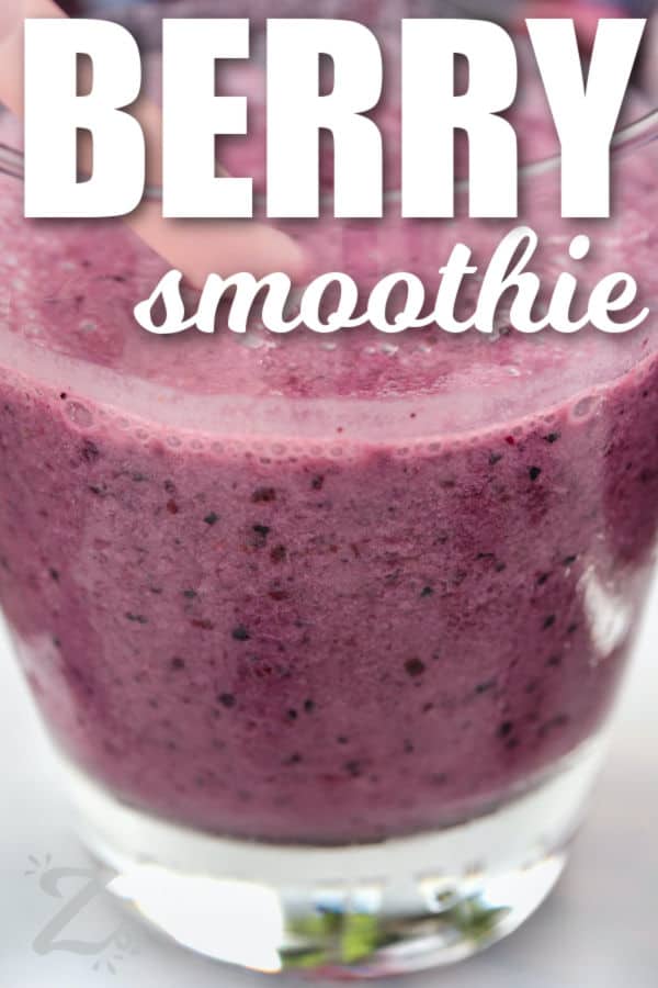 close up of Mixed Berry Smoothie in a glass with a title