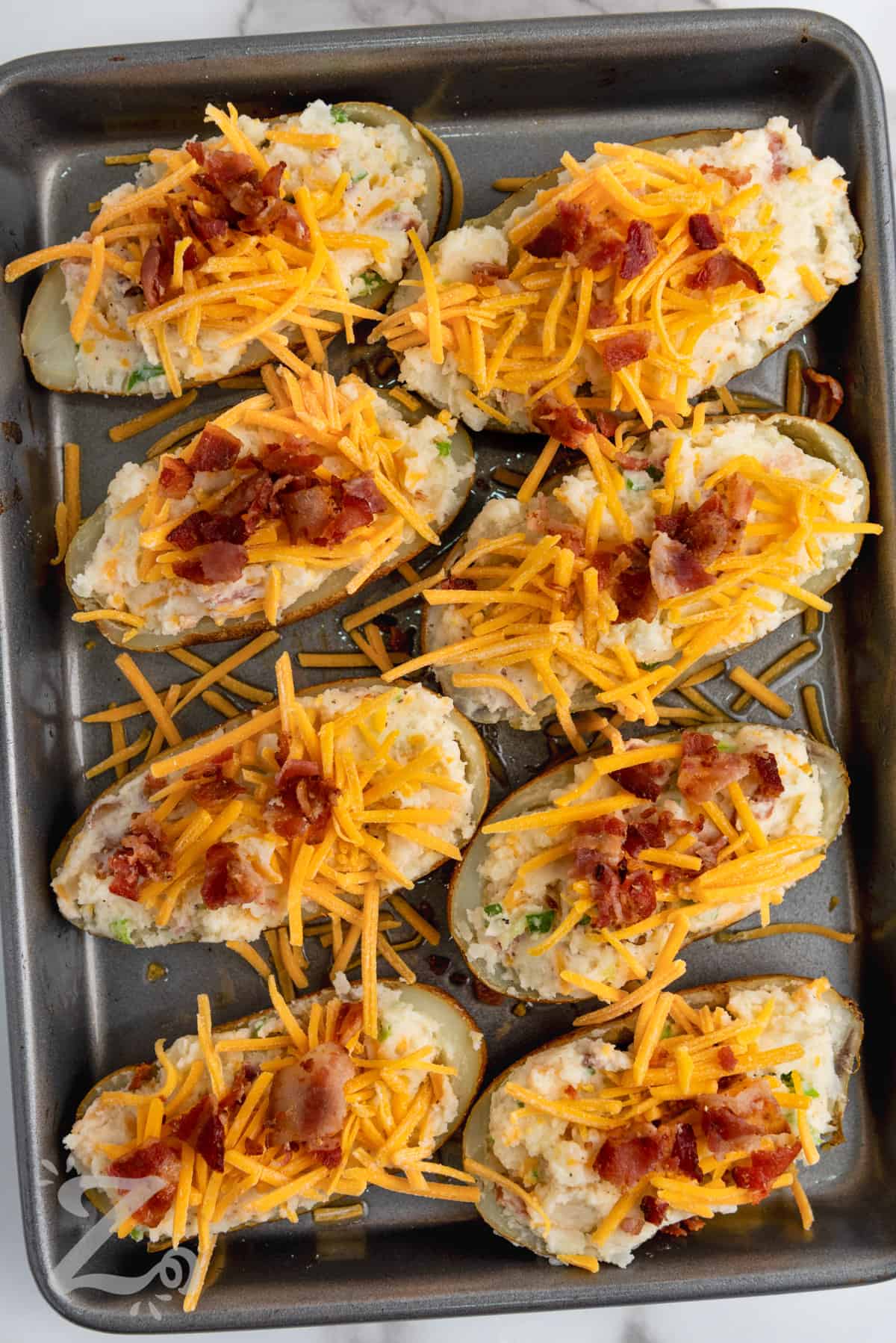 Twice Baked Potatoes on a sheet pan before cooking