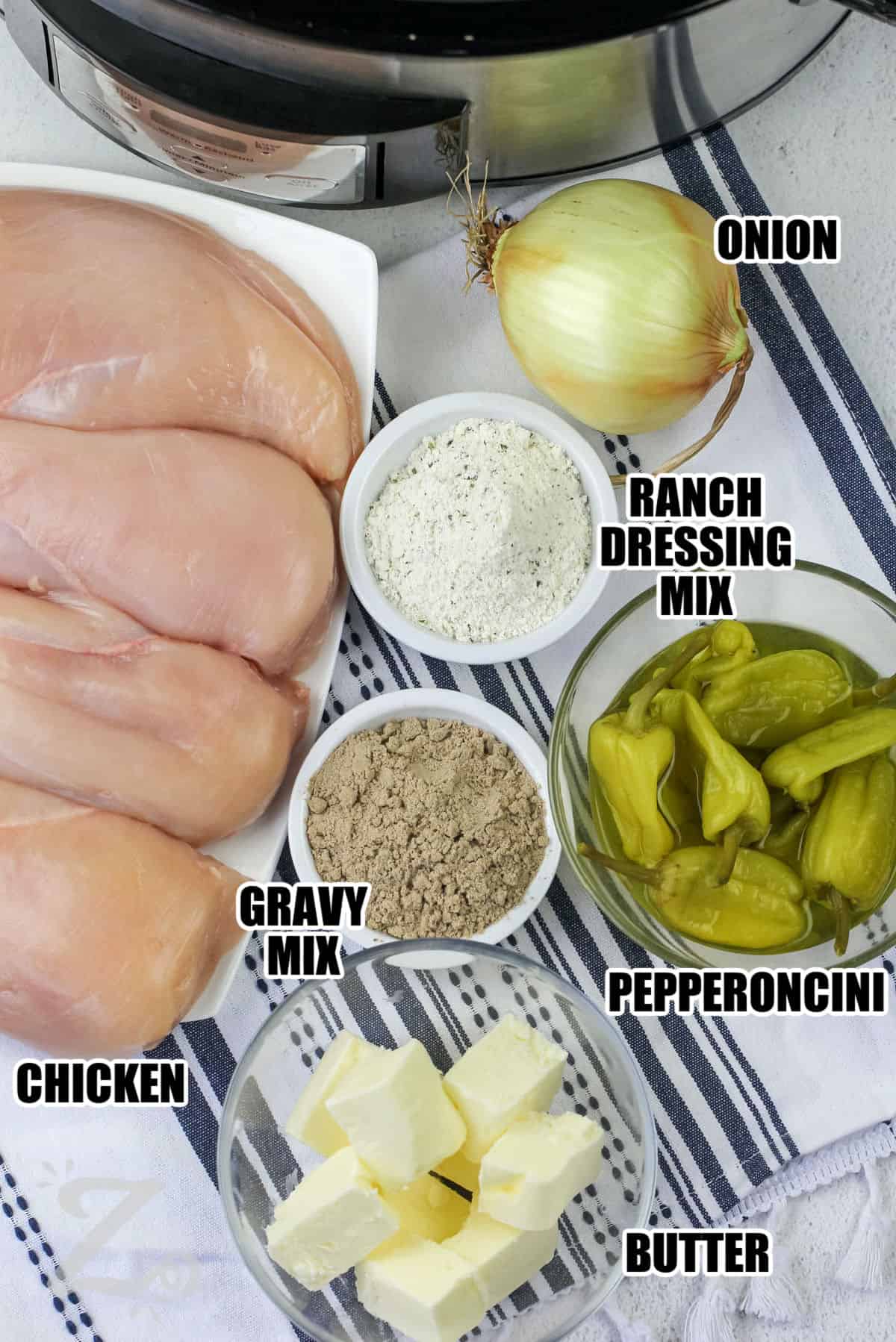 onion , ranch dressing mix , pepperoncini , butter , gravy mix , and chicken with labels to make Mississippi Chicken